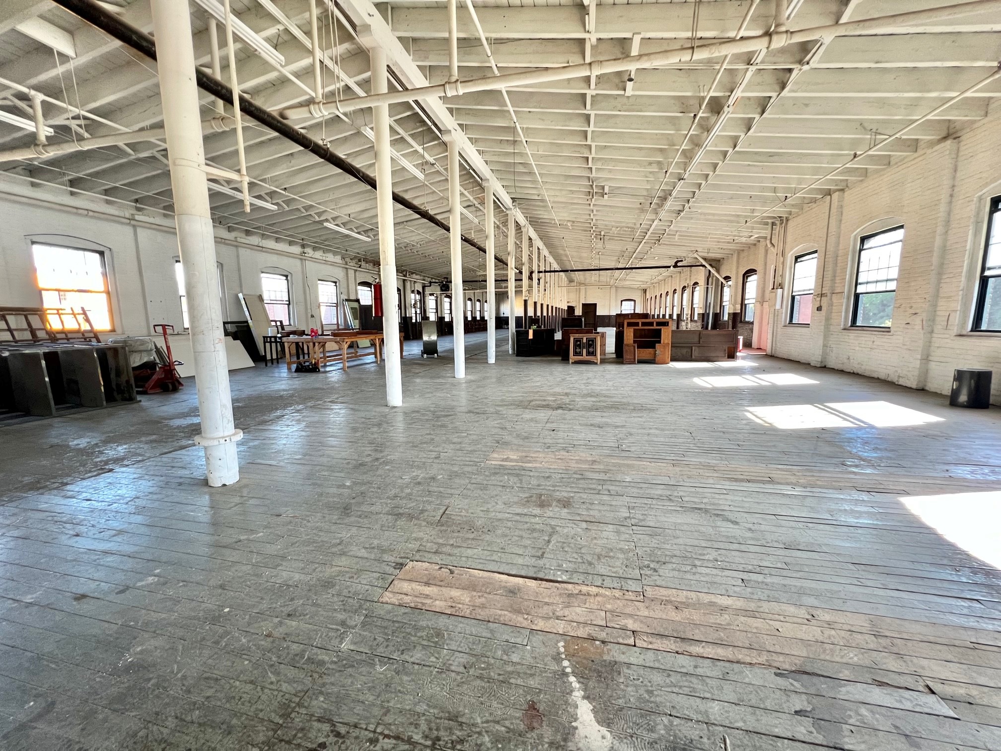 Warehouse in Yonkers, NY with high ceilings in an industrial zone as a commercial property.